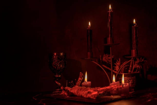 Voodoo Doll on a wooden background with dramatic lighting